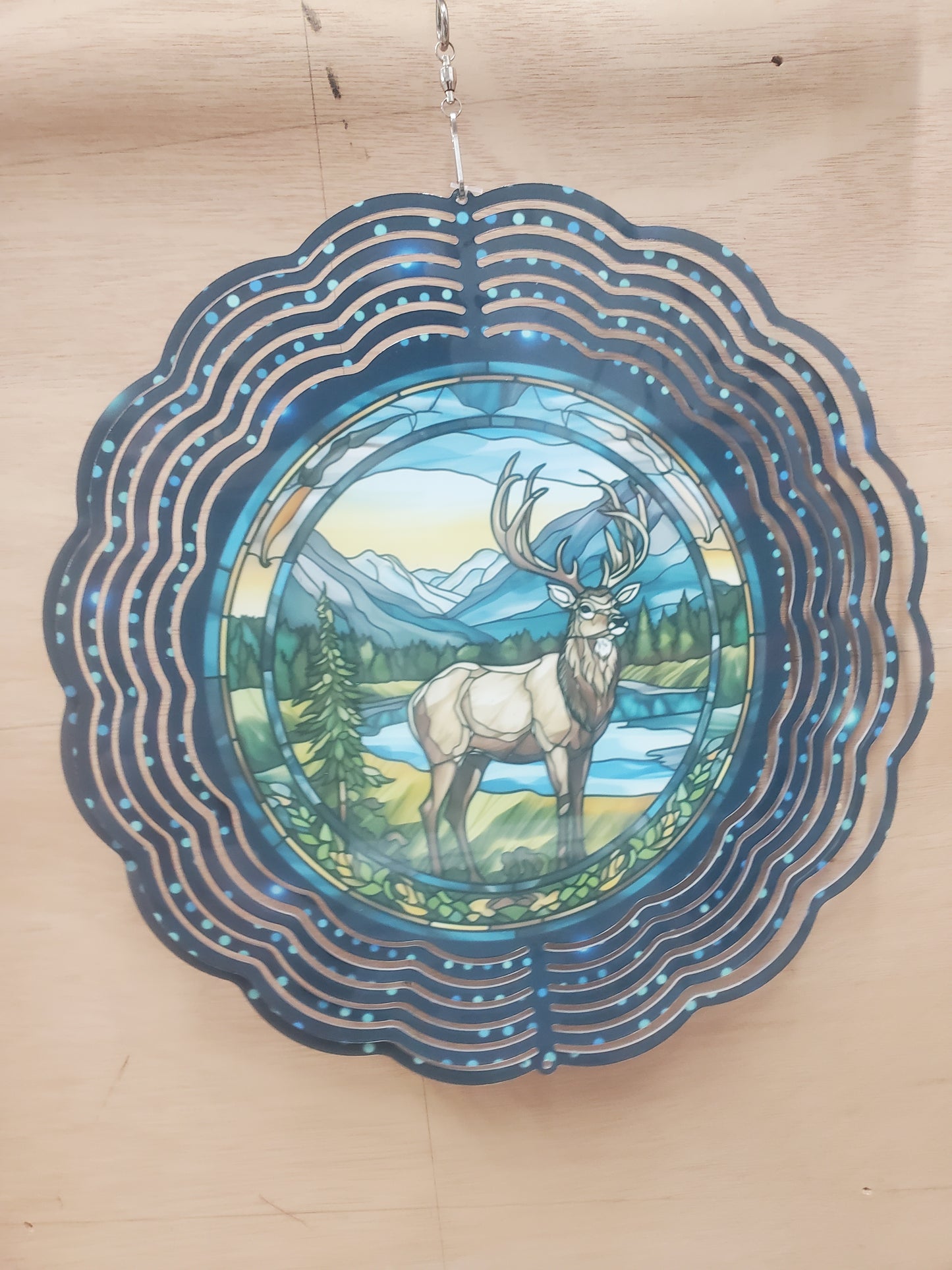 Stag deer wind spinner with mountain background