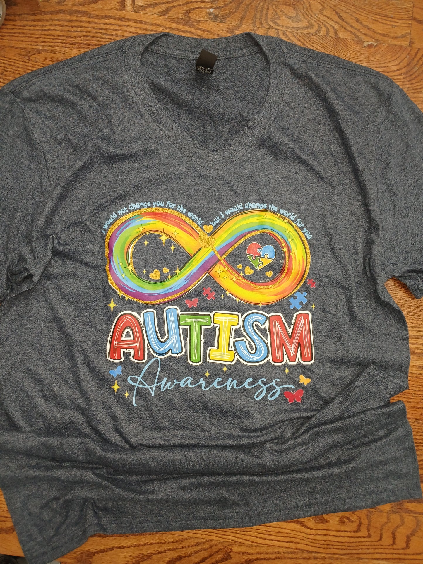 Gray t-shirt with a colorful 'Autism Awareness' design