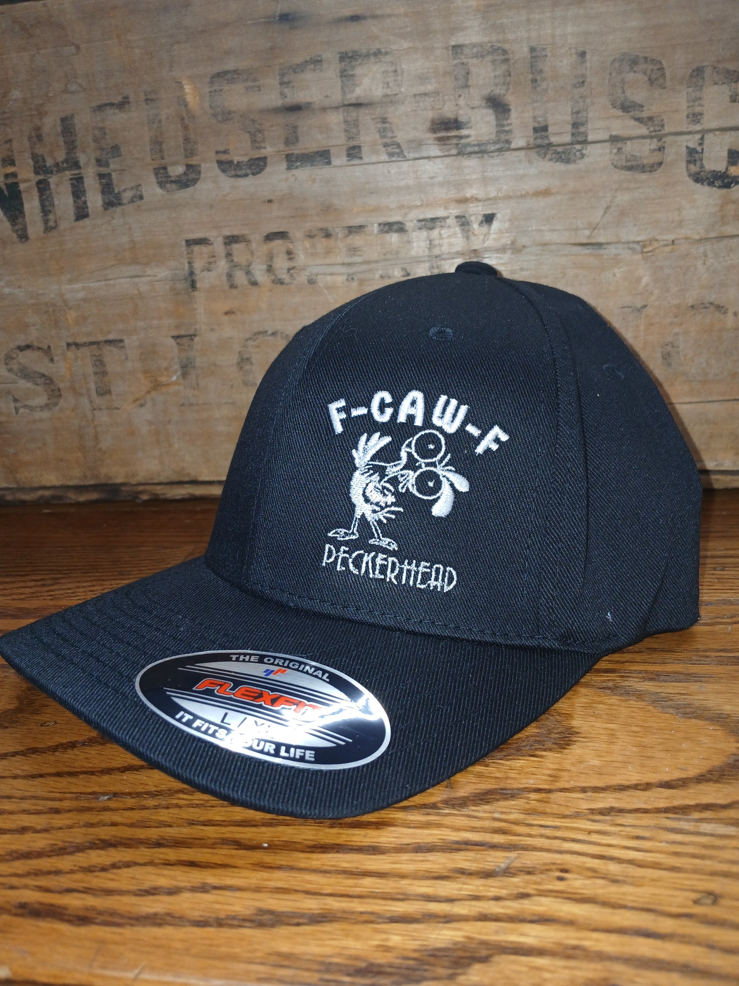 Black cap with F-Caw-F Peckerhead and crazy chicken graphic