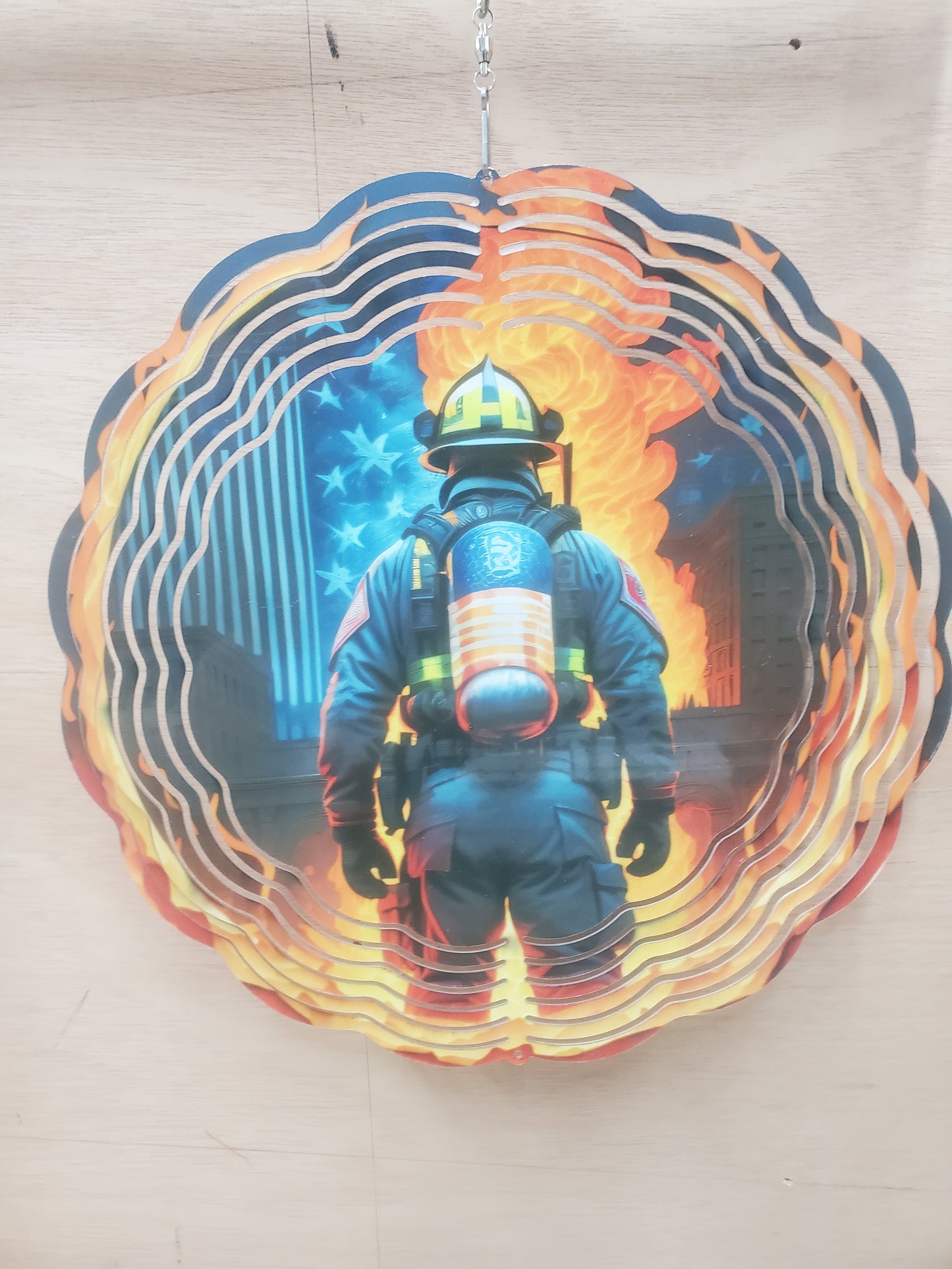 Firefighter in front of fire 10 inch wind spinner 