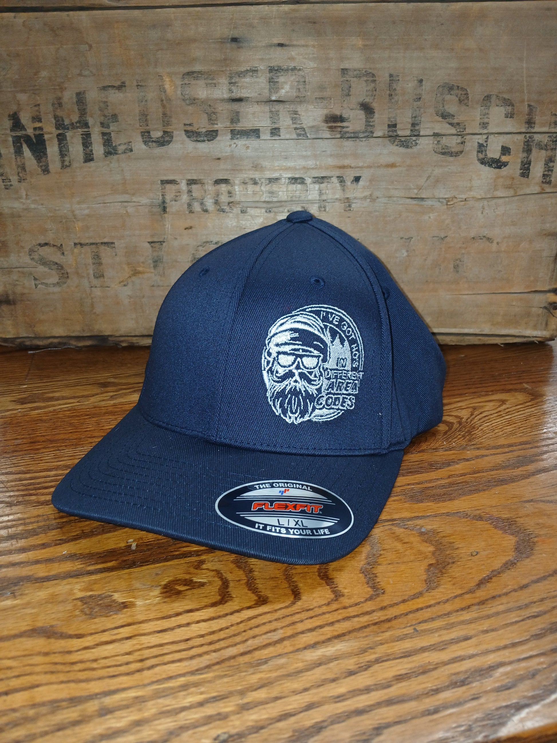 Navy blue cap with text I've got HOs in different area codes with Santa design