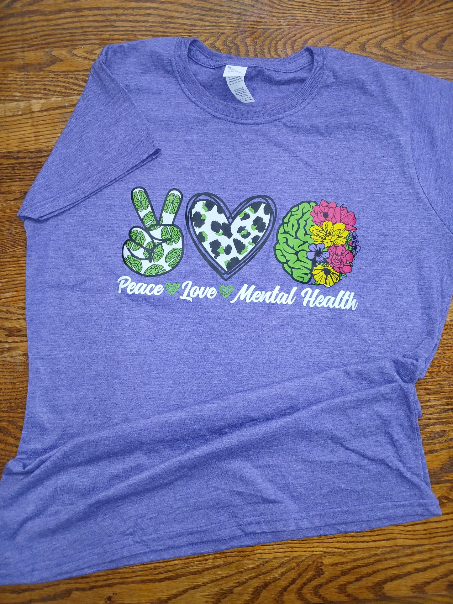Purple t-shirt with colorful graphic design Peace Love Mental Health